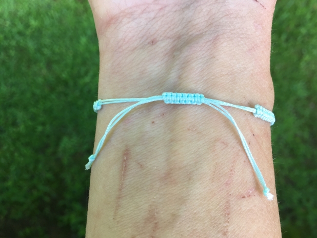 Metal stamped nylon cord bracelet